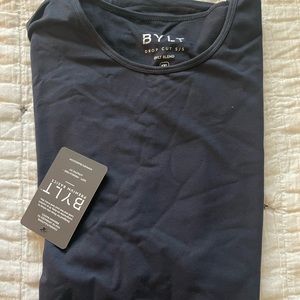 Brand new BYLT basics Mens T shirt. Dark navy blue color. Drop hem.